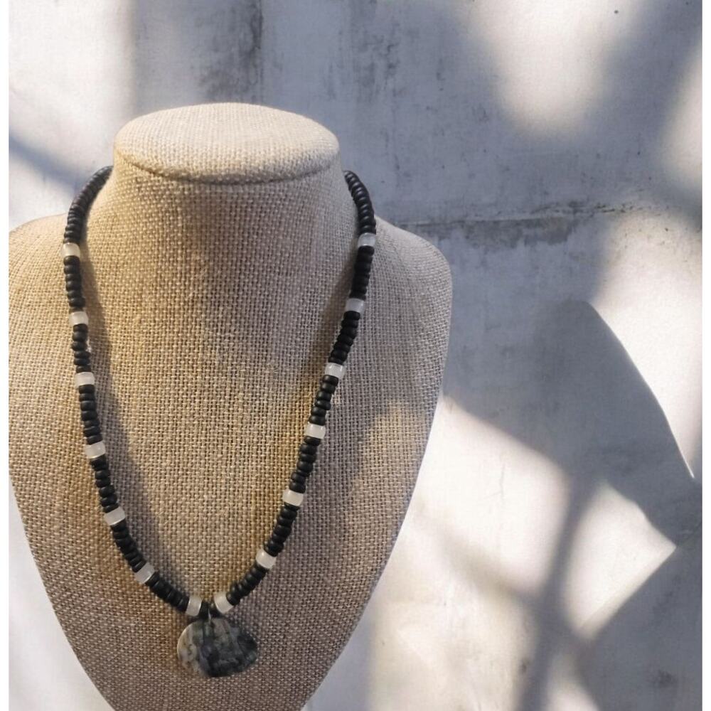 Vintage black and white beaded necklace with mother of pearl pendant